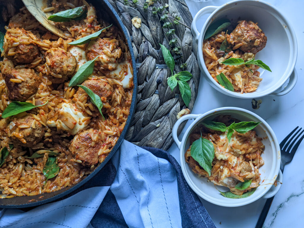 chicken meatballs and orzo in red pepper sauce plated 
