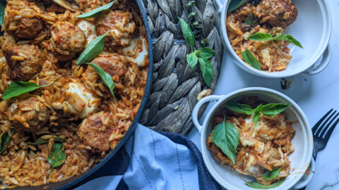 chicken meatballs and orzo in red pepper sauce plated