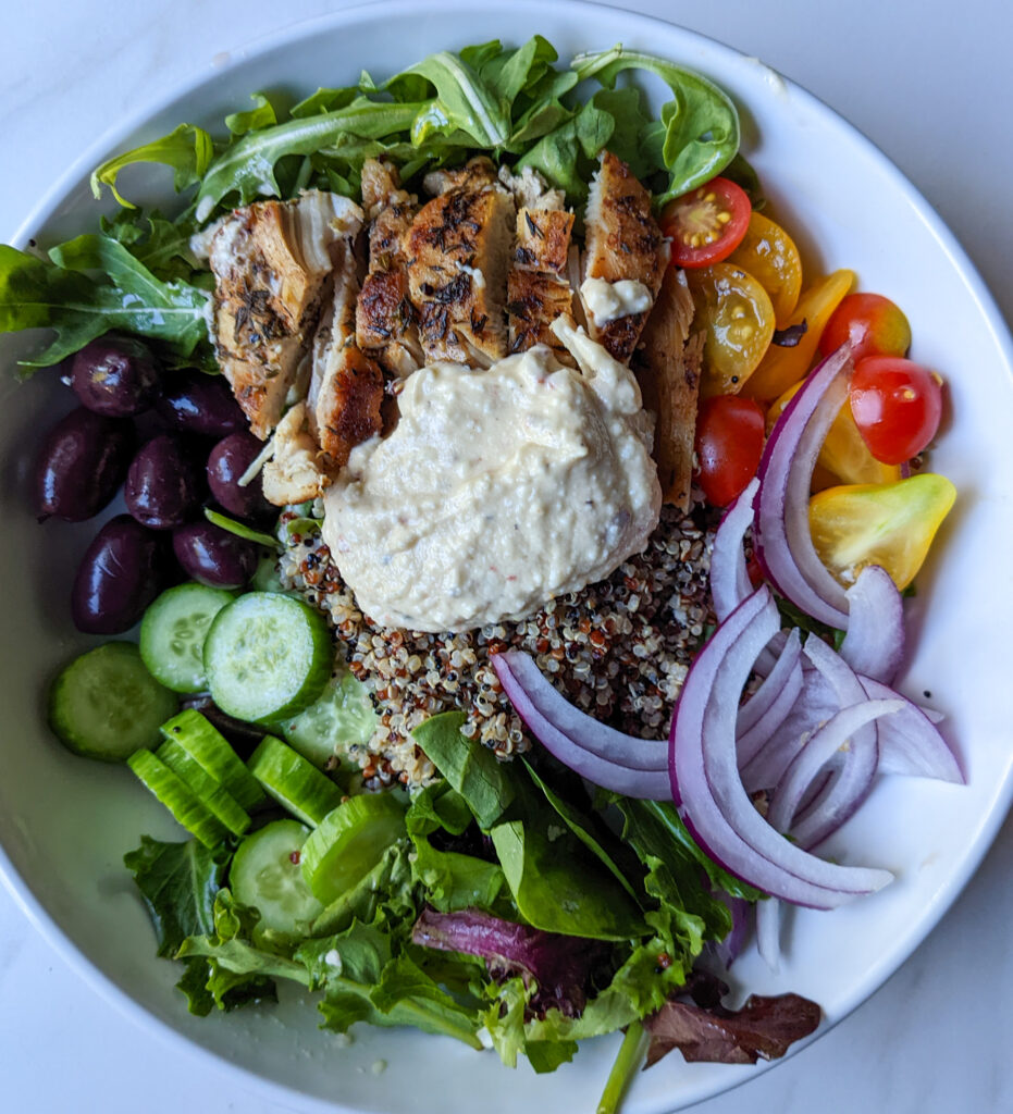 grain bowl with grilled chicken and creamy hummus dressing 