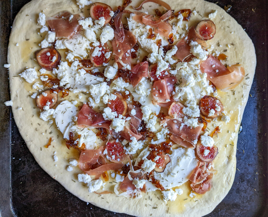 precooked caramelized onion and prosciutto pizza