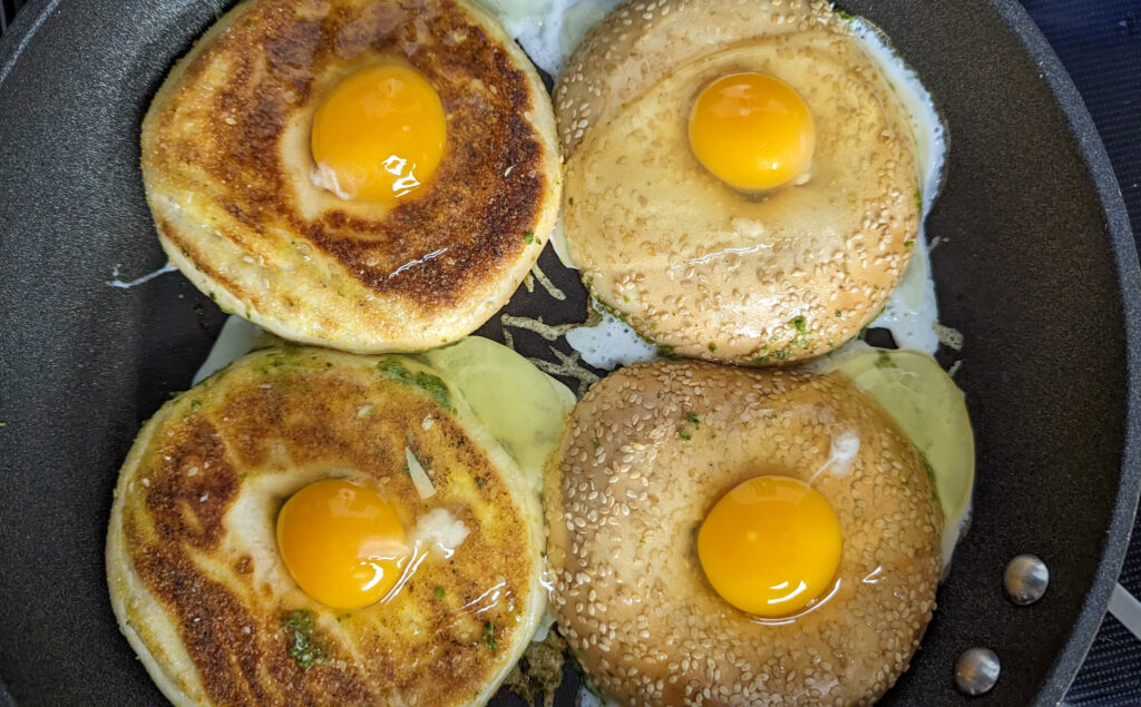 Cooking pesto egg in a bagel hole