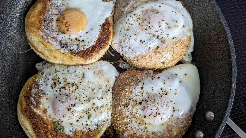 Cooking pesto egg in a bagel hole