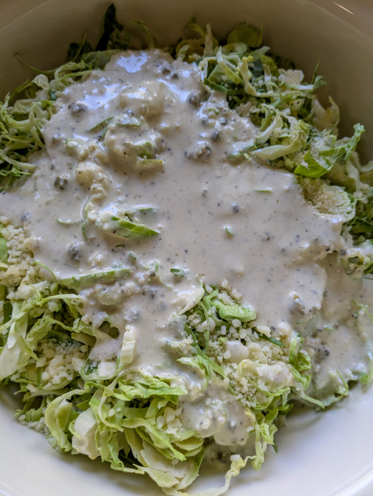 Shaved Brussel Sprout Caesar Salad with Toasted Bread Crumbs