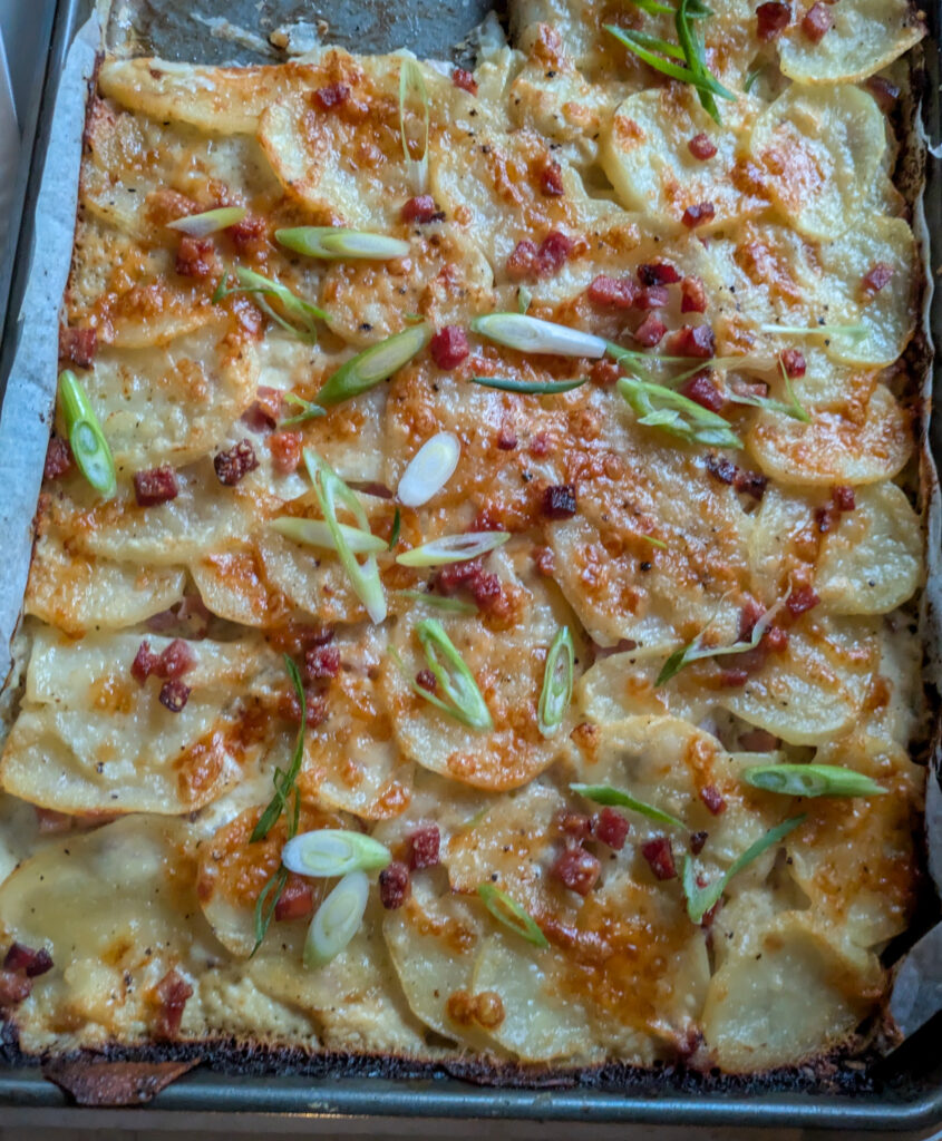 sheet pan ham and cheddar scalloped potatoes