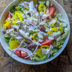 Greek salad with creamy Caesar dressing