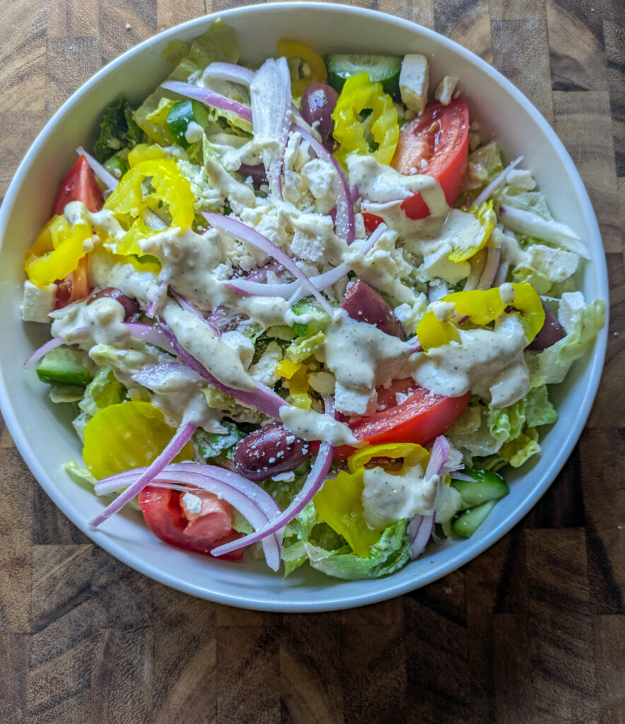 Greek salad with creamy Caesar dressing