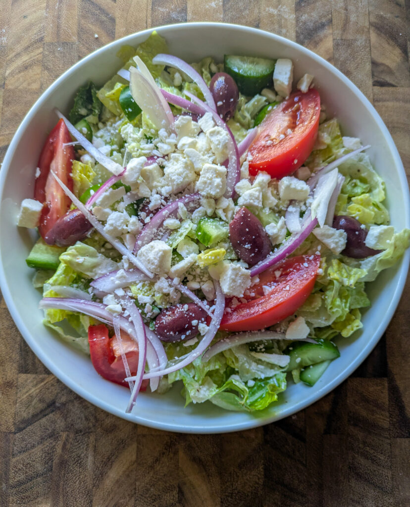 Greek salad with creamy Caesar dressing