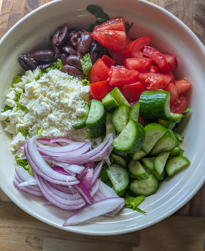 Greek salad with creamy Caesar dressing