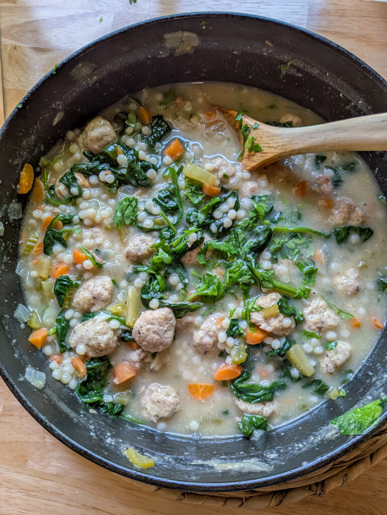 Homemade Italian wedding soup with pork meatballs